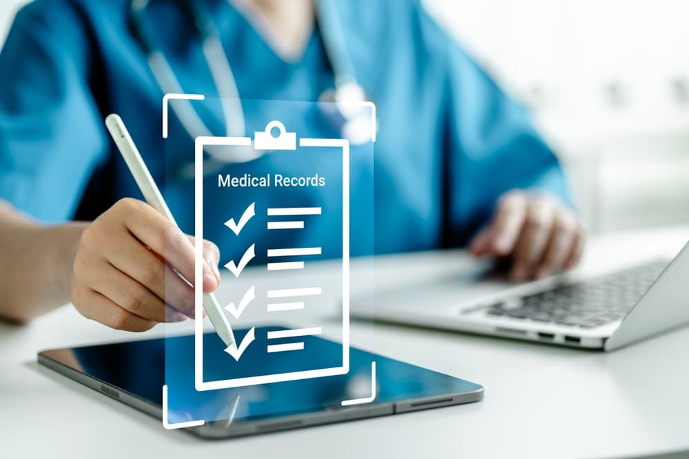 Medicine doctors inspect electronic medical records on tablets.