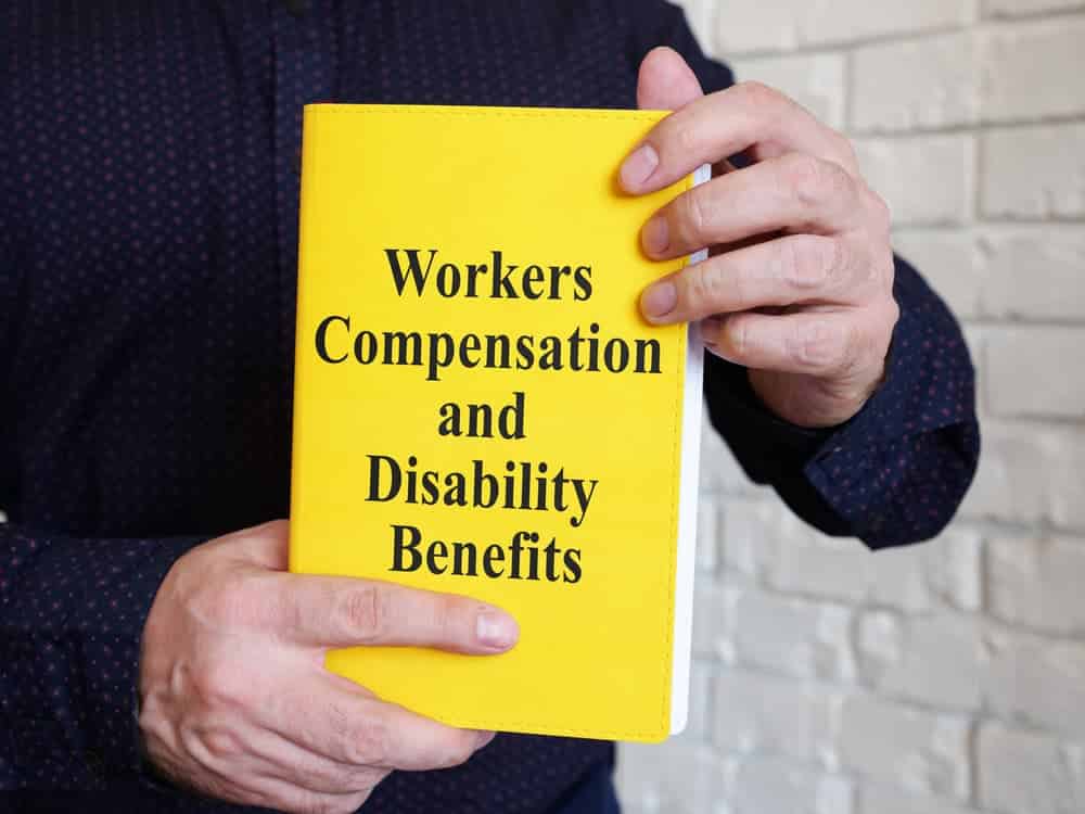 Workers Compensation and Disability Benefits is shown on a book