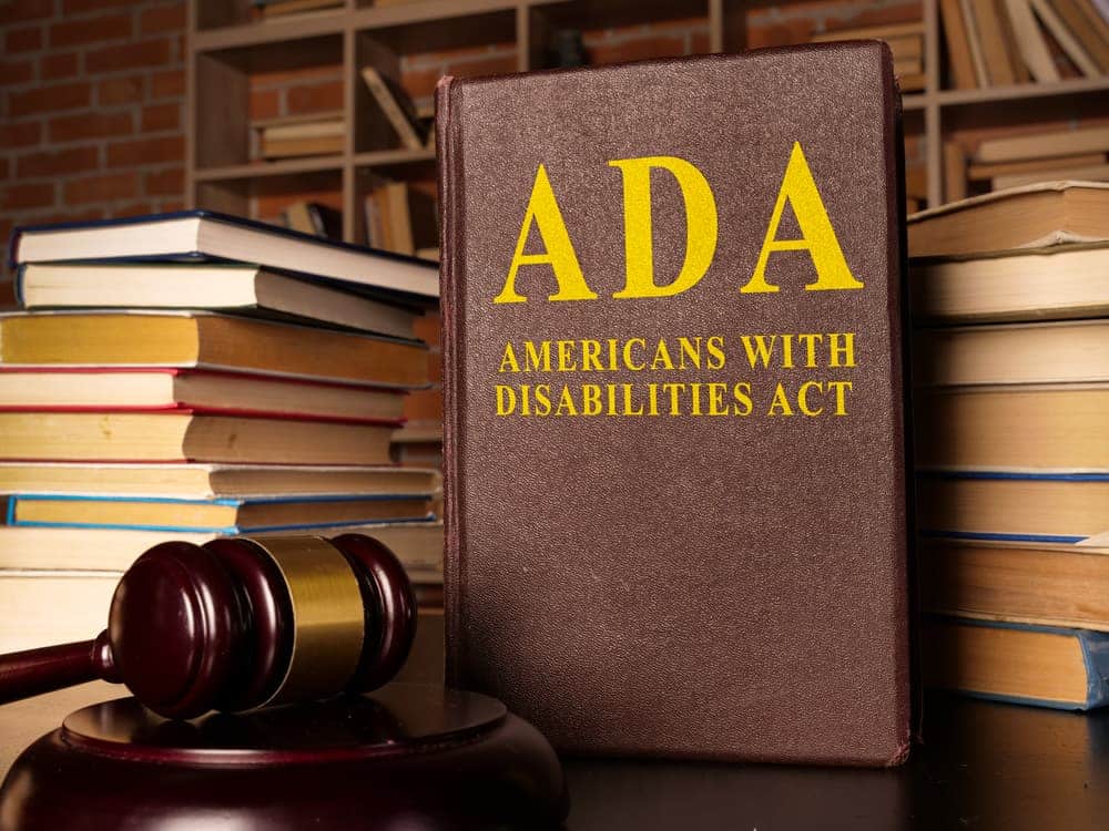 Gavel and Americans with Disabilities Act ADA book with documents