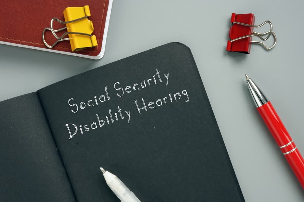 Social Security Disability Hearing sign on the sheet.